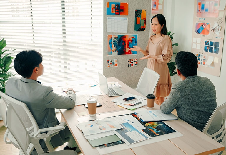 Creative director leading meeting with designers