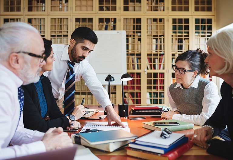 Lawyers working together in law library