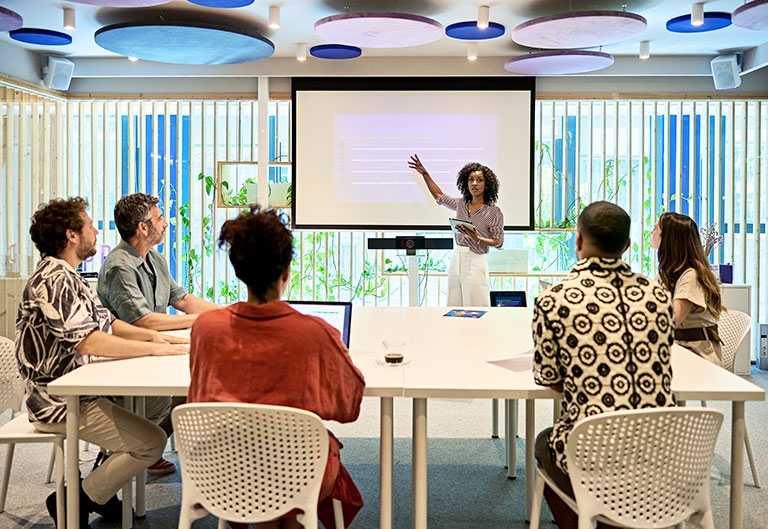 Manager leading her team in a meeting/presentation