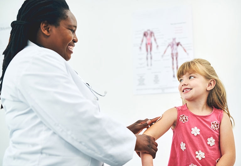 Nurse examining young child