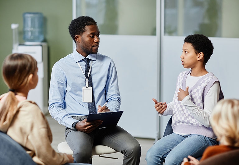 School psychologist working with small group of students