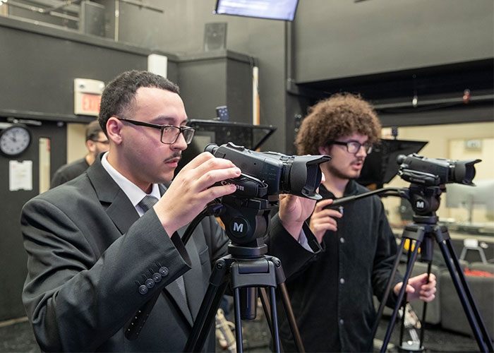 Raymond checking the cameras before Anchor TV broadcast