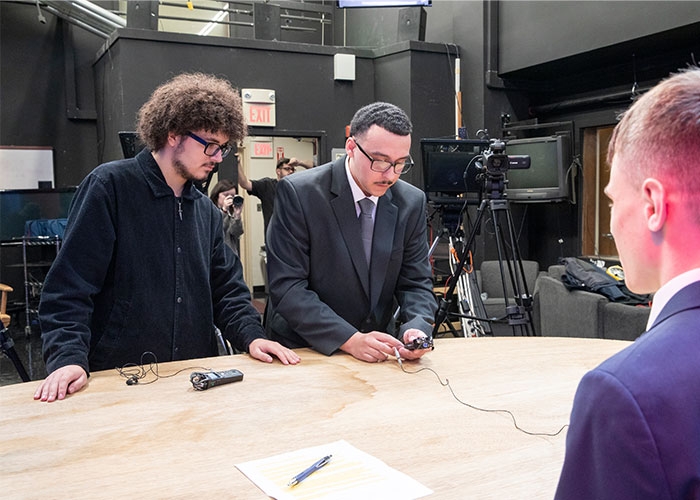 Raymond Baccari checking the mics before Anchor TV broadcast