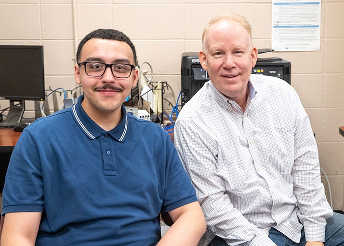 Raymond Baccari and Jim Hummel in Anchor newsroom