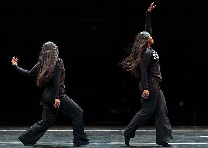 Dance major, Andreina Mendoza in motion, moving on stage, in black