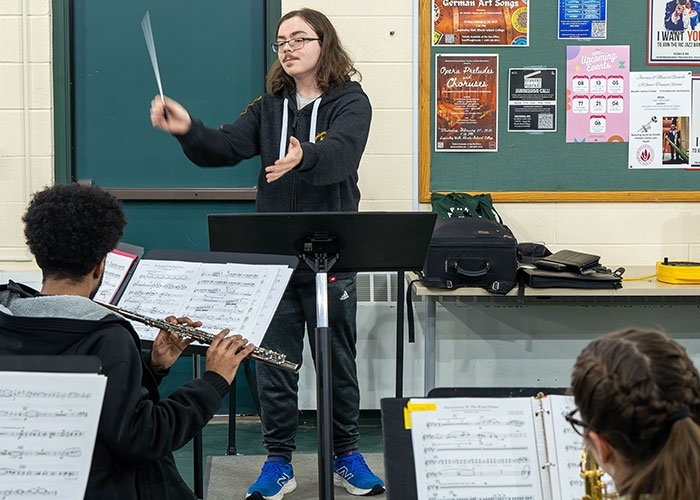Zach Fulford, music major, conducting students