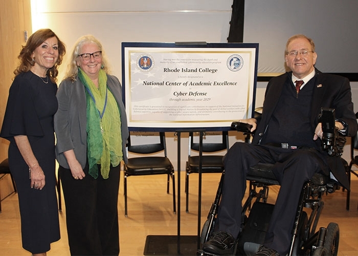 Raimondo, Mello-Stark, and Langevin pose with NSA certification document