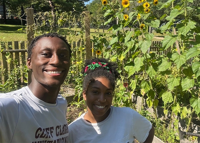 Kwesi Moa and his partner, Morgan Jackson, in a garden