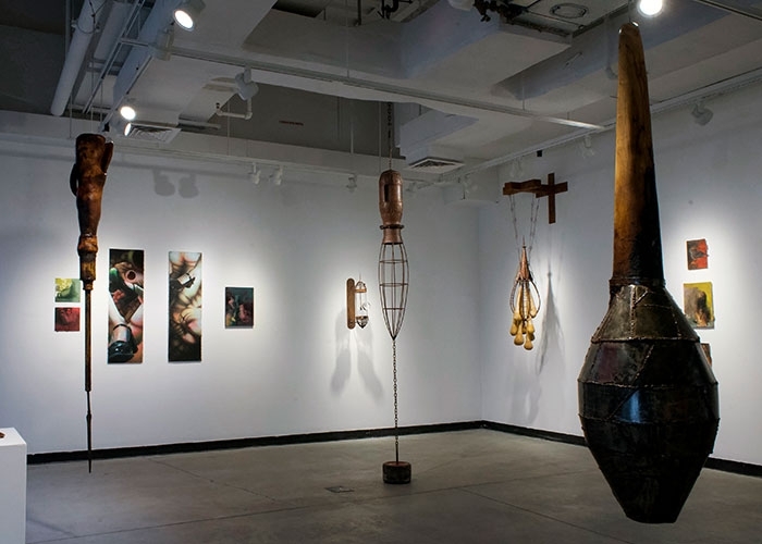 “Phantom Pains,” a group exhibition that included Alex Tum’s hanging sculptures at RIC’s Chazen Family Gallery.