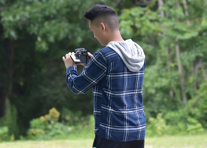 Alex Geil adjusting camera