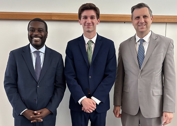 DiGregorio with Rep. Gabe Amo and Rep. Seth Magaziner at RIC, commemorating the new Registered Apprenticeship Program for cybersecurity students.