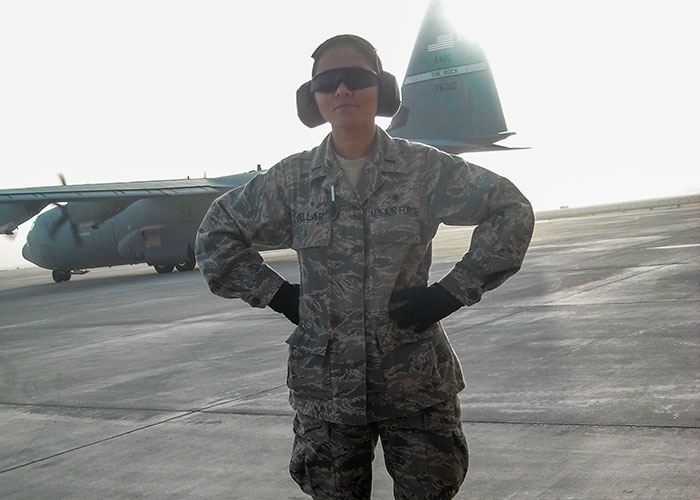 Mirna Cuellar working in the military near plane