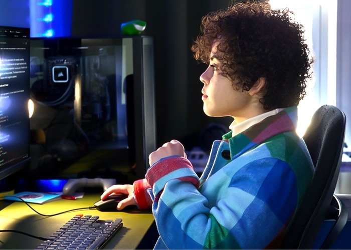 Sonya Cheteyan, AI major, working at computer