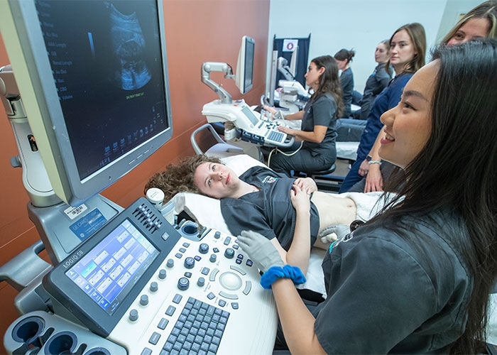 RIC sonography concentrators practice in the lab at RINEC