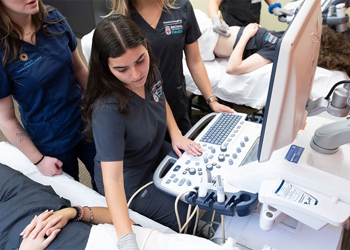 Medical Imaging students working with patient and equipment