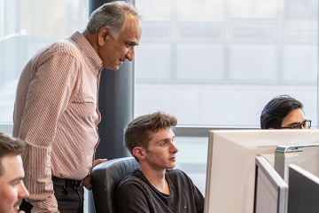 Finance professor working with students