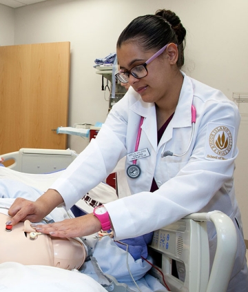 Nursing student performing an examination