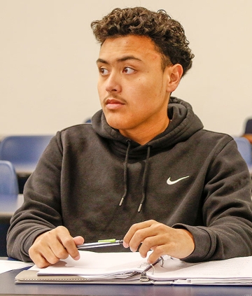 Student in an accounting class taking notes
