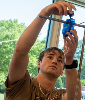 Physics student working in lab