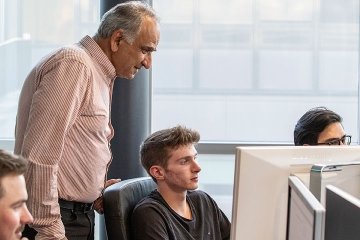 Finance professor working with students