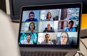 Laptop showing zoom call participants