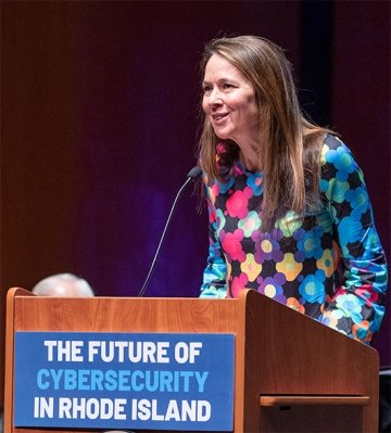 Jen Easterly speaking at podium for the Cybersecurity Institute's Launch