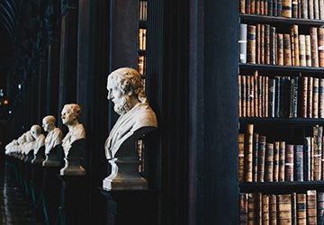 Busts of famous philosophers and old library
