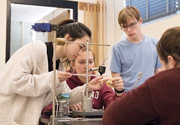Physics students working together in a lab