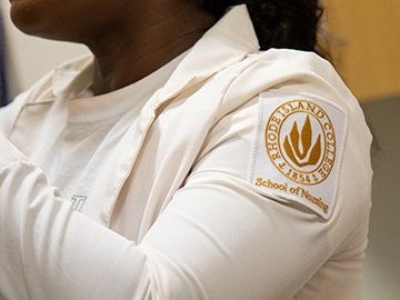 Nursing student wearing School of Nursing badge