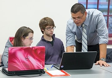 Nonprofit students working with faculty member