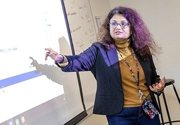 Professor teaching economics class