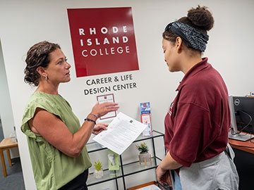 Career & Life Design Center director working with a student