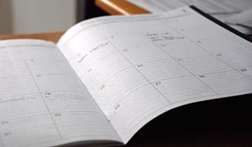 Calendar/planner open on desk
