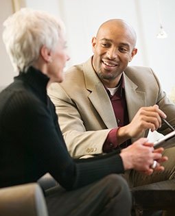 Investor speaking with woman