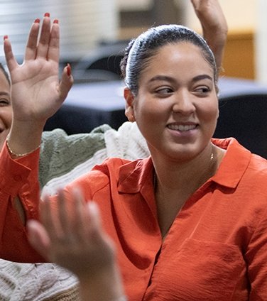 Center of Excellence student raising hand