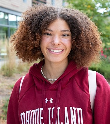 Smiling female student in RIC sweatshirt