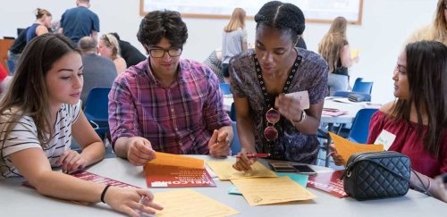 students and teacher in a classroom setting