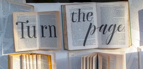 Open books with text "turn the page"