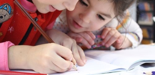 Two little girls studying
