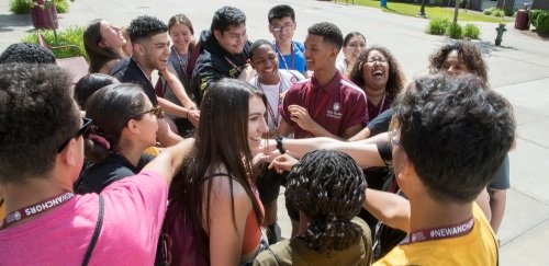 Students in a huddle outside