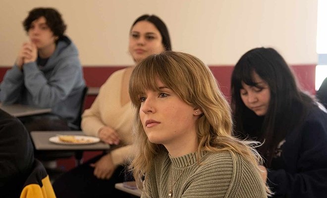Students engaged, listening, in a political science class