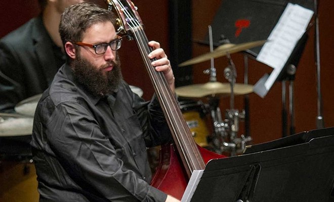 Concert jazz band, focus on cello player