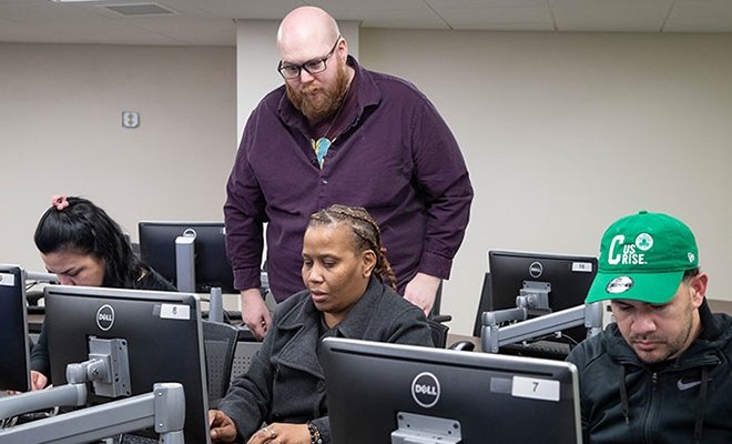Workforce development hub students at computers in IT class
