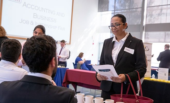 Students meeting with employers at an Accounting and Business Job and Internship Fair