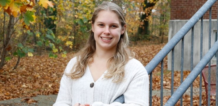 Ashley Boisvert standing in front of dorm